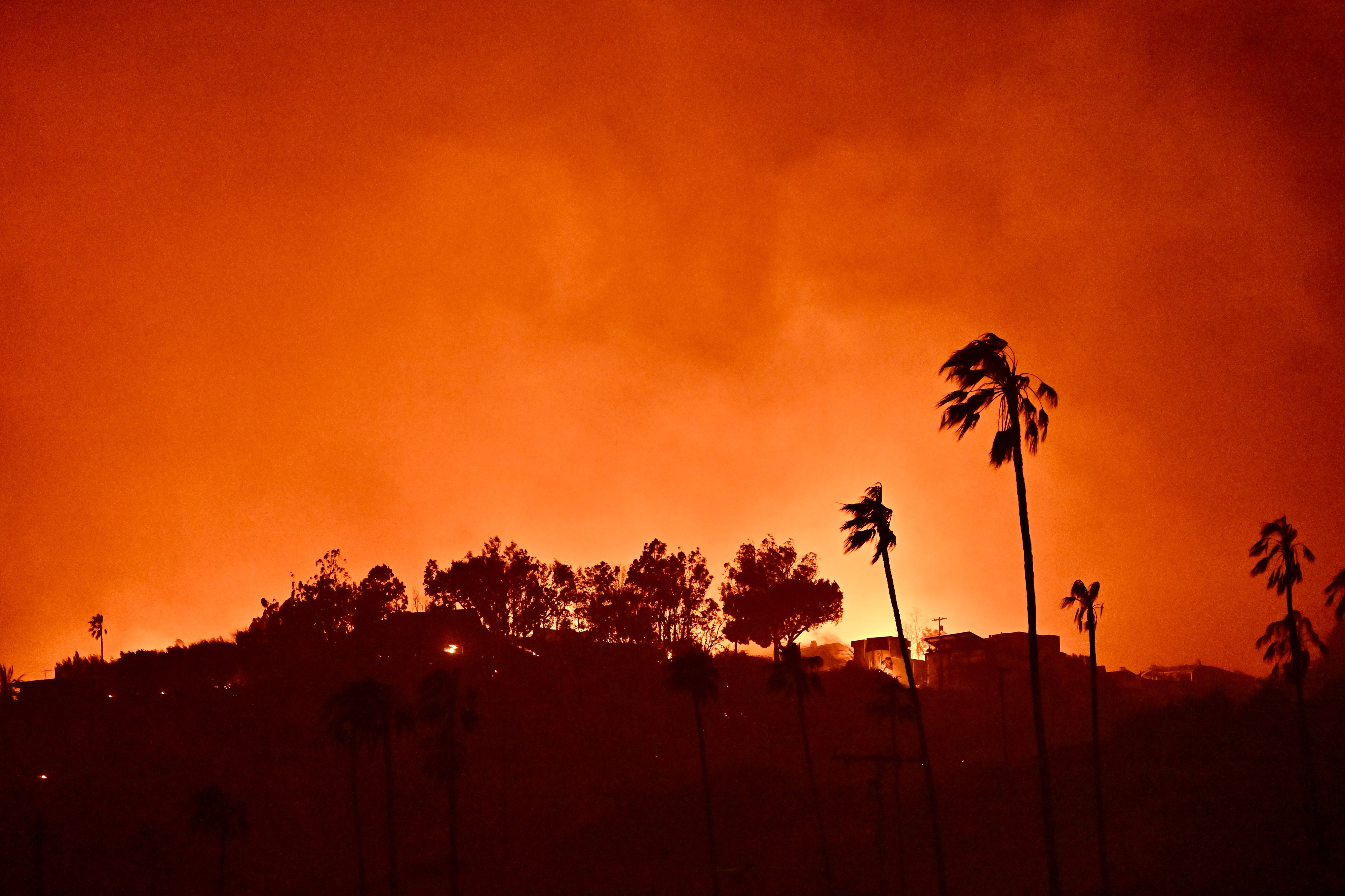 Homes burn during the Palisades fire on Wednesday, January 8, 2025, in Pacific Palisades, California | Source: Getty Images